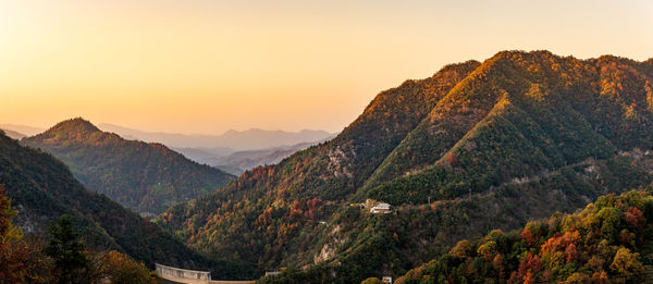 Scenic view of mountains against sky during sunset