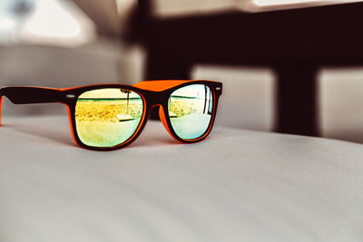 Close-up of sunglasses on table