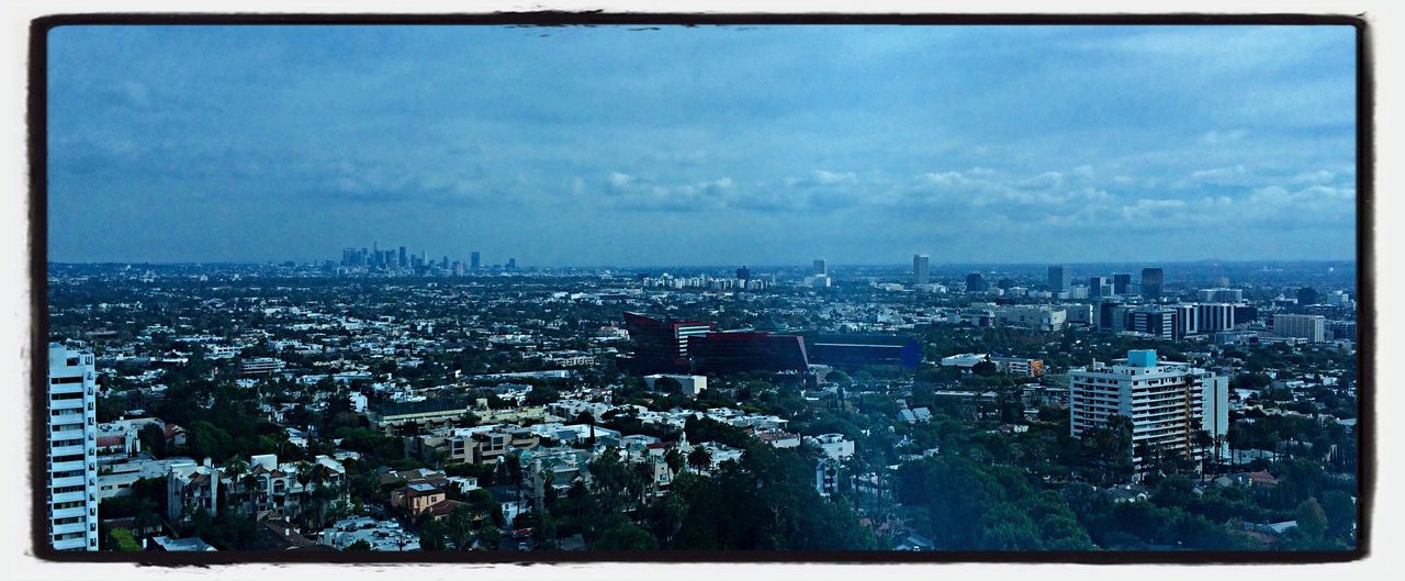 transfer print, cityscape, city, building exterior, architecture, auto post production filter, sky, built structure, crowded, illuminated, cloud - sky, high angle view, residential district, water, skyscraper, blue, residential building, cloud, residential structure, city life