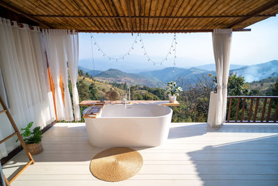 Outdoor bathtub with mountains view , doi chang, chiang rai, thailand