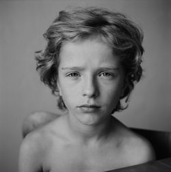 Portrait of shirtless boy at home