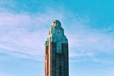 Low angle view of modern building against cloudy sky