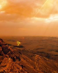 Scenic view of landscape against sky during sunset