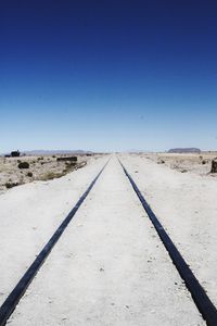 View of railroad tracks against clear sky