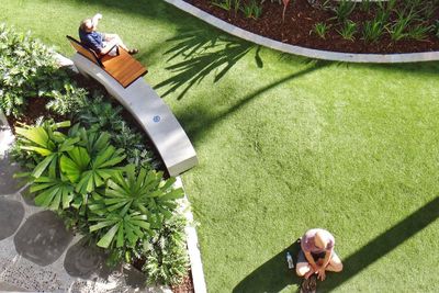 High angle view of men relaxing in park