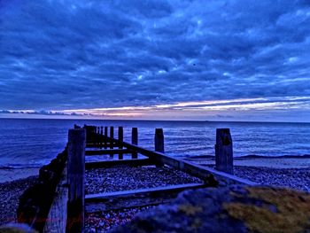 Scenic view of sea against cloudy sky