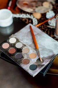 High angle view of paintbrushes on table