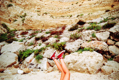 Low section of woman on field