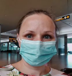 Close-up portrait of a young woman wearing face mask