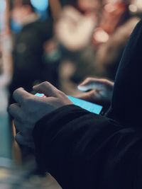 Close-up of man using mobile phone
