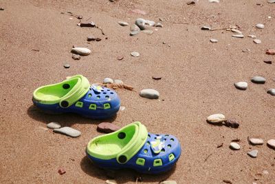 High angle view of shoes on sand