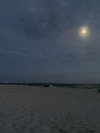 Scenic view of sea against sky at night