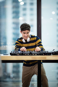 Man playing guitar on table
