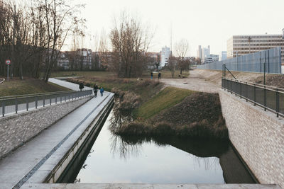 Reflection of trees in water against sky