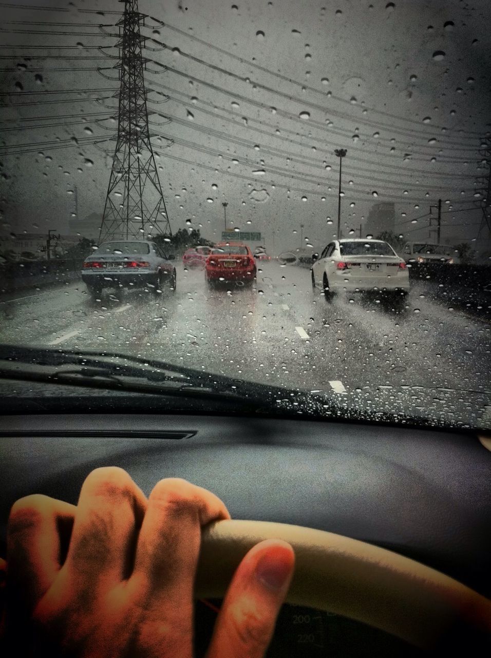 part of, person, transportation, cropped, personal perspective, mode of transport, holding, unrecognizable person, human finger, water, car, wet, close-up, street, leisure activity, nautical vessel, lifestyles