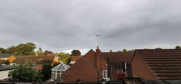 Houses and buildings against sky