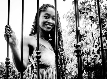 Portrait of smiling young woman standing outdoors