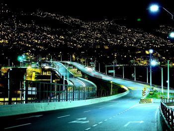 Light trails on road in city at night