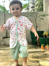 Portrait of cute girl standing outdoors