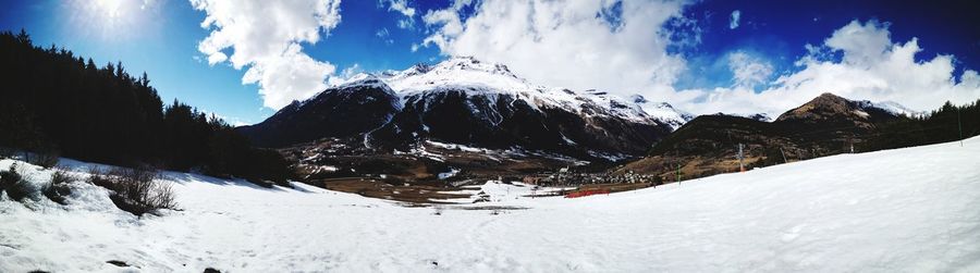 Panoramic view of snowcapped mountains against sky