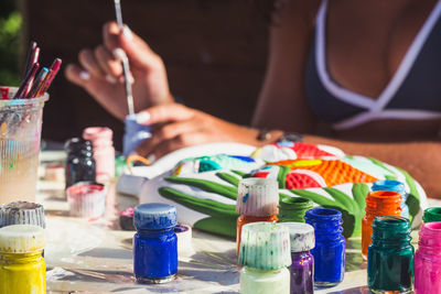 Close-up of hand with multi colored candies