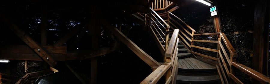 High angle view of illuminated staircase in abandoned building