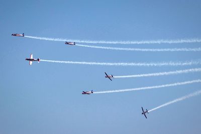 Low angle view of airplane flying in sky