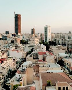 High angle view of buildings in city against sky