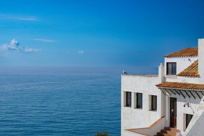 Scenic view of sea against blue sky