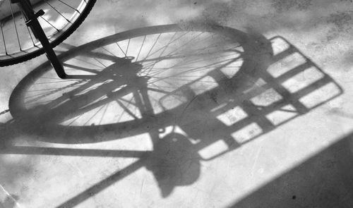 High angle view of shadow of bicycle on street