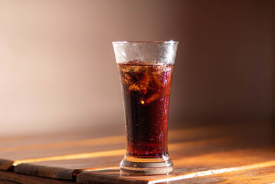 Close-up of beer glass on table