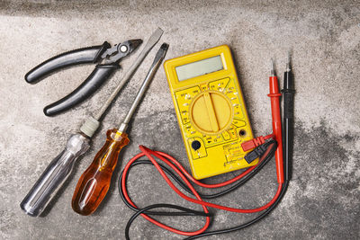 High angle view of various equipment on paper