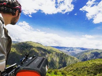 Man on mountain against sky