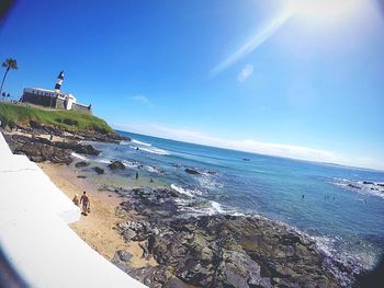 Scenic view of sea against blue sky