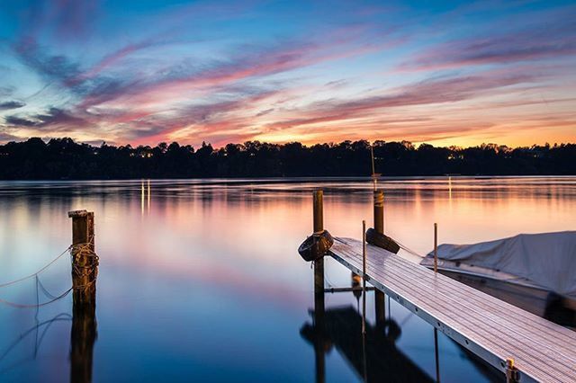 sunset, tranquility, water, tranquil scene, sky, scenics, lake, beauty in nature, reflection, silhouette, nature, idyllic, orange color, pier, tree, cloud - sky, cloud, calm, dusk, outdoors