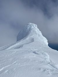 Snow covered mountain against sky