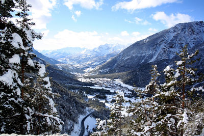 Scenic view of mountains against sky during winter