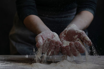 Close-up of man preparing food