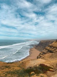 Scenic view of beach against sky