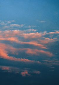 Low angle view of cloudy sky at sunset