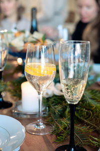 Two glasses with alcohol on the new year's table. glass of champagne and cocktail 