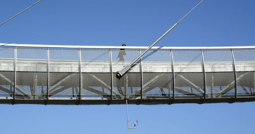 Low angle view of built structure against clear blue sky