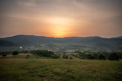 Scenic view of landscape against sky during sunset