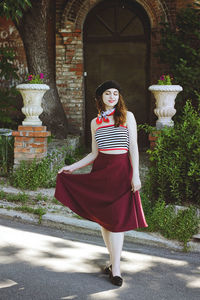 Full length of woman standing on street