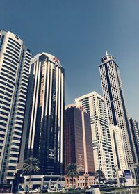 Low angle view of modern buildings against clear sky