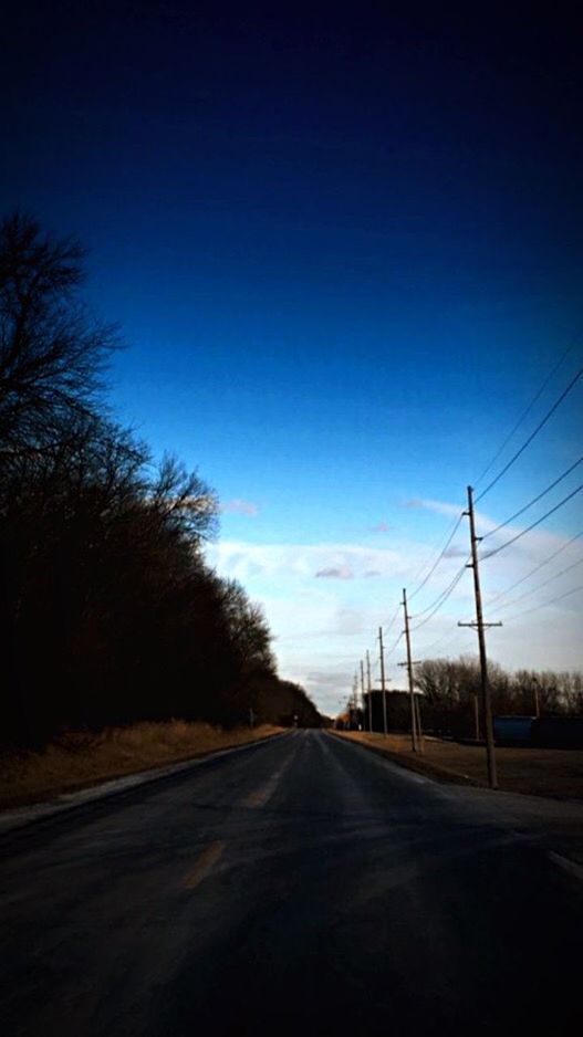 the way forward, transportation, road, diminishing perspective, country road, vanishing point, road marking, tree, sky, empty road, long, electricity pylon, clear sky, street, empty, landscape, asphalt, tranquility, bare tree, power line