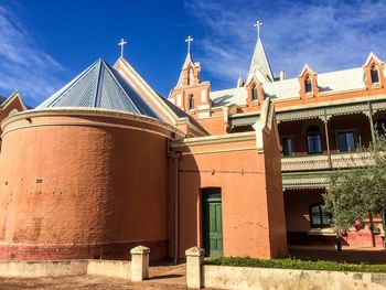 Low angle view of building against blue sky