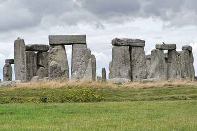 Built structure on field against sky