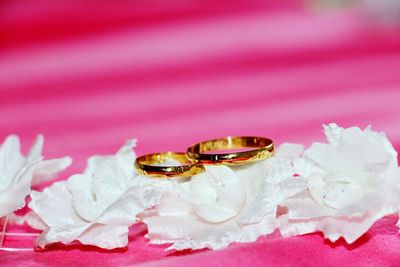 Close-up of wedding rings on fabric