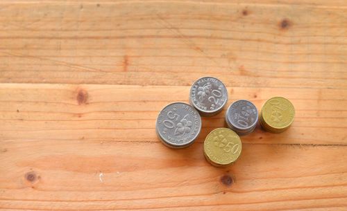 High angle view of coins on table